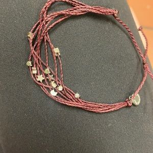 burgundy with little stars, cats and other charms